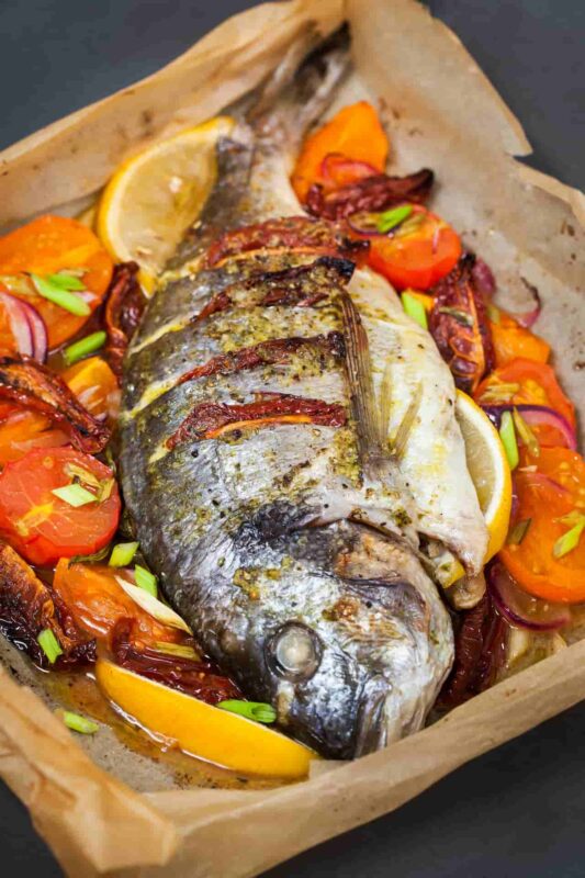 Baked dorada with potatoes Golden baked